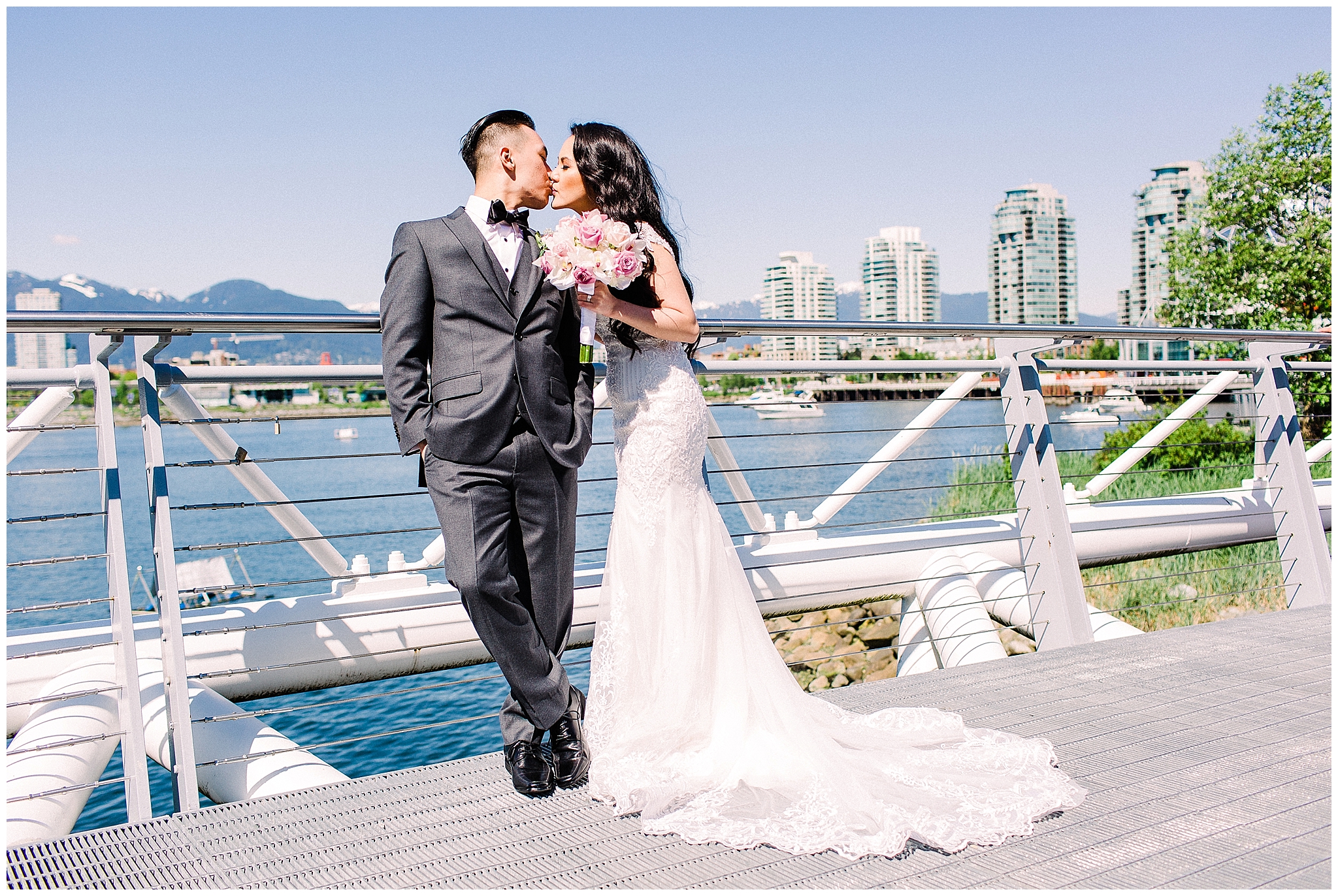 bride and groom kiss during portraits at their Downtown Vancouver Chinese Wedding